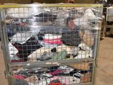 a metal cart with a lot of clothes in it