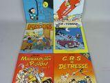 quatre livres pour enfants alignés sur une surface blanche