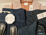 a pile of men ' s clothing on display in a store