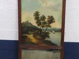 tableau représentant un paysage avec une rivière et un arbre, dans un cadre en bois