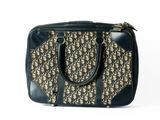 an image of a black and beige bag on a white background