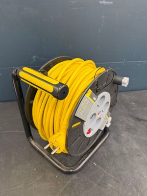 an image of a reel with a yellow hose attached to it