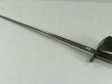an image of a sword with a pointed blade on a white surface