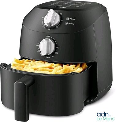an image of a black air fryer with french fries in it