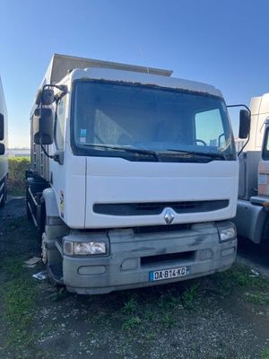 two trucks that are parked next to each other