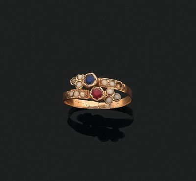 an 18k gold, ruby, and pearl ring