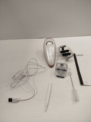 a white table topped with electronic items on it