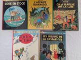 plusieurs livres pour enfants sont alignés sur une surface blanche