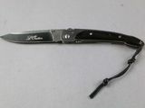 a knife that is laying on a table