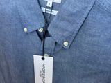 the shirt is blue and white with a tag on it