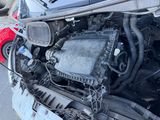 a car that has a broken engine in the back of it