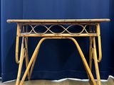 a close up of a table with a blue curtain in the background