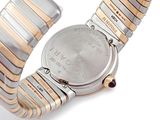 an image of a close up of a wrist watch on a white surface