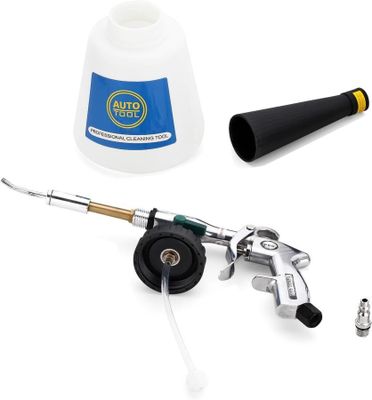 a spray gun, hose, and other tools on a white surface