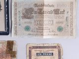 three old french bank notes and a note with a picture of a man