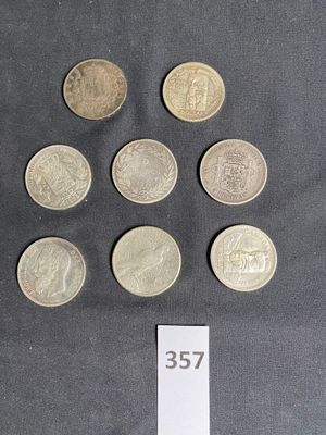 six different types of coins on a table with a price tag