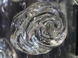 a close up of a glass vase filled with water