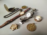 a lot of watches and other items on the table