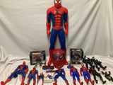 spider - man action figures and toys are displayed on a table
