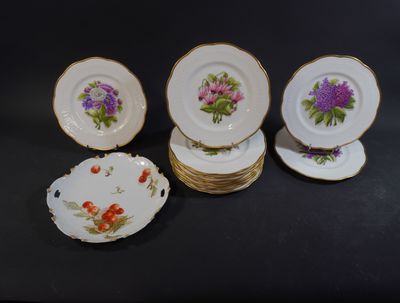 a group of six plates with flowers on them sitting on a table