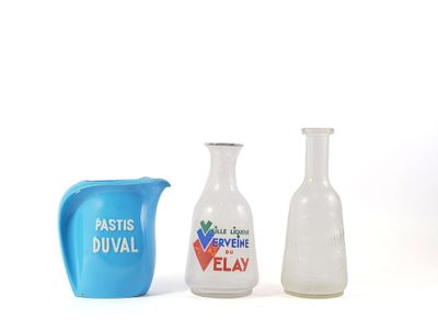 three vases and a pitcher sitting next to each other on a table