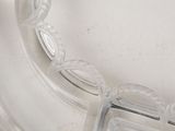 a clear glass plate with a decorative design on it