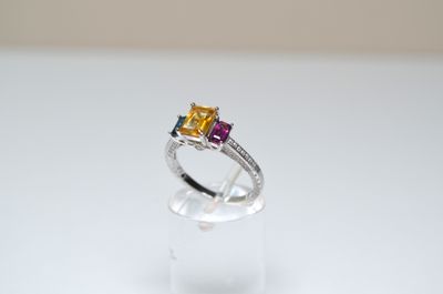 a close up of a ring on a clear surface with a white background