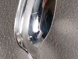 a spoon that is sitting on top of a table
