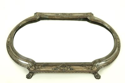 an antique silver plated mirror with ornate design on a white background