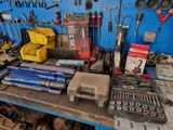 many tools on a workbench in a garage