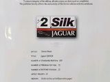 the certificate for the two silk jaguar is displayed on the table