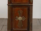 an old wooden cabinet with a marble top on a wooden floor