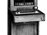 an old black and white photo of a computer with a keyboard