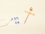 a close up of a cross and a tag on a white surface