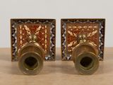 pair of antique brass candlesticks with blue and red glass inserts