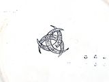 a white plate with a black and white design on it