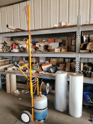 a room with a lot of items on the shelves