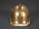 a gold helmet on a black background