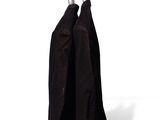two jackets hanging on a clothes rack on a white wall