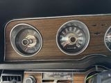 three gauges on the dashboard of a car