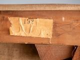 a close up of a piece of wood with a number on it