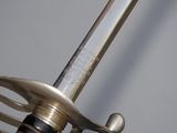 a close up of a sword with a metal handle