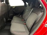 a red car with two seats in the back of it