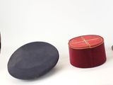 three hats that are sitting next to each other on a table