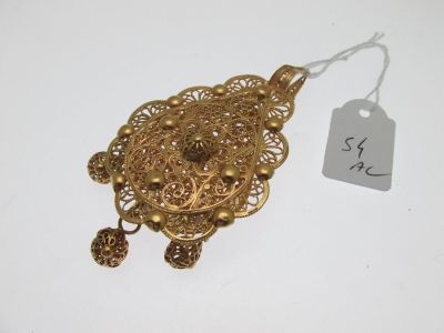 a close up of a gold necklace with a price tag on it