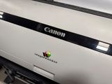 a canon printer sitting on top of a desk