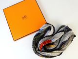an orange box with a black and white scarf and a black and white scarf