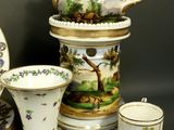 many different types of china on display on the table