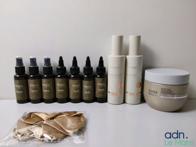 many bottles of skin care products sitting on a table