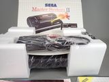 a box with a video game on it and a game controller in it